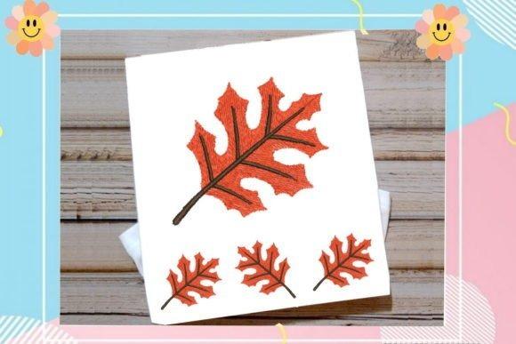 Fall embroidery designs featuring a large and three smaller orange autumn leaves stitched on white fabric
