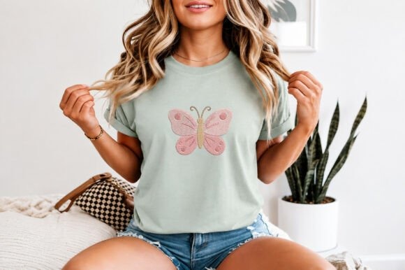 Etsy embroidery files for machine embroidery projects featuring a butterfly design on a light green t-shirt worn by a woman