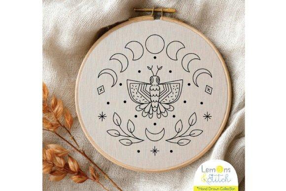 Hand embroidery designs featuring a butterfly surrounded by moon phases and decorative celestial elements in a hoop