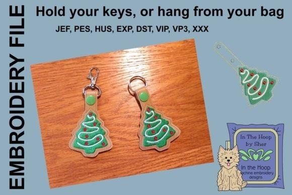 4x4 machine embroidery projects Christmas tree key fobs with green fabric and red accents on wooden surface