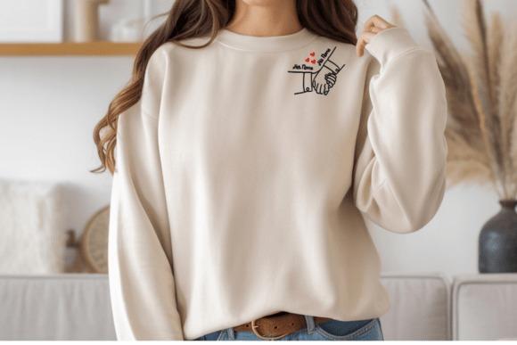 Sweatshirt with embroidered wedding gift design of couple holding hands and small red hearts