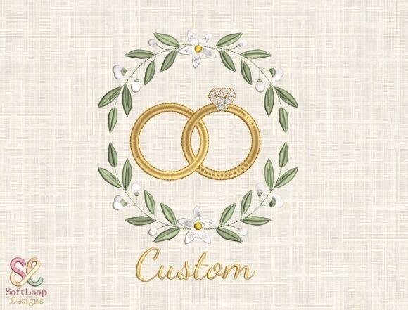 Wedding embroidery hoop designs featuring intertwined gold wedding rings with diamond and floral wreath