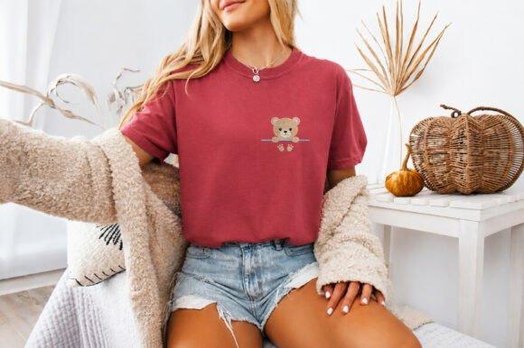 Woman wearing red t-shirt with small teddy bear animal embroidery design on chest