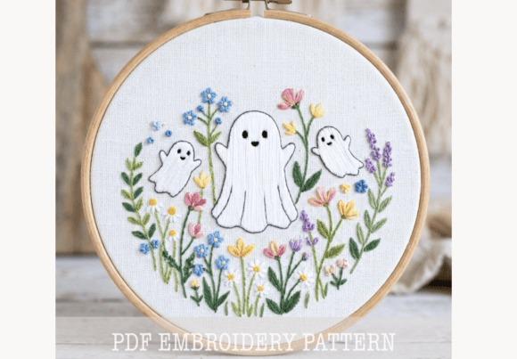 Fall embroidery patterns featuring a Floral Ghost Trio with cute ghosts and colorful flowers in an embroidery hoop