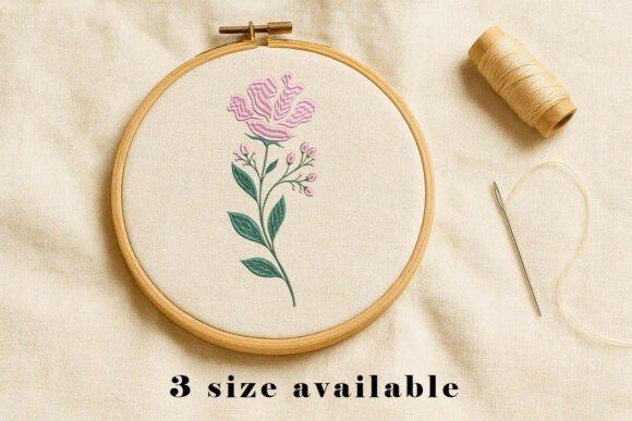Floral wildflower embroidery design with pink flower and green leafy stems in wooden hoop — tote bag embroidery