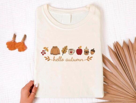 Fall embroidery designs featuring hello autumn lettering with sweater, coffee mug, apple, candle, acorn, berries, and leaves