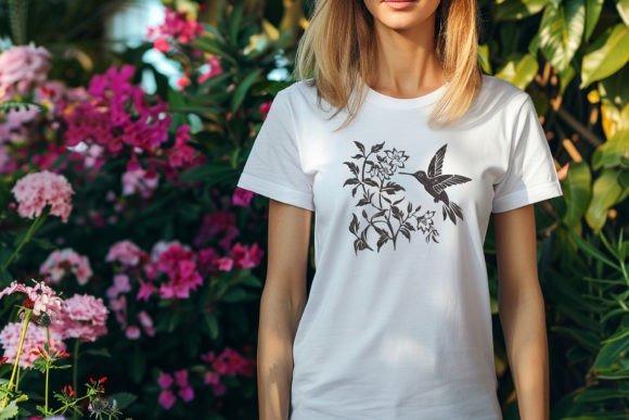 White t-shirt with bird embroidery designs featuring a hummingbird and floral motif