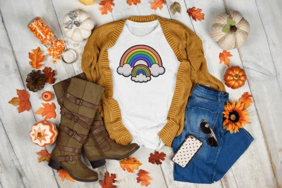 Baby onesie with rainbow and clouds embroidery design surrounded by autumn leaves, boots — baby blanket embroidery