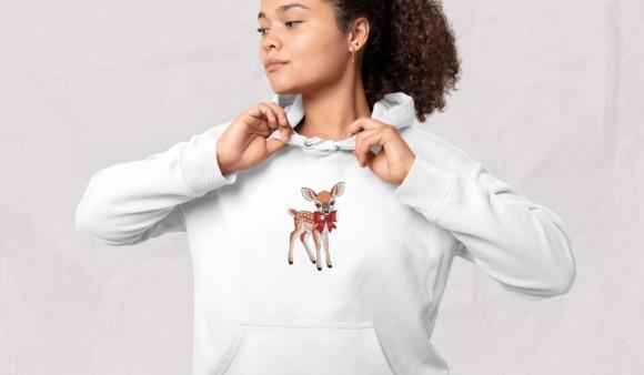 White hoodie with animal embroidery of a small woodland deer with a red bow