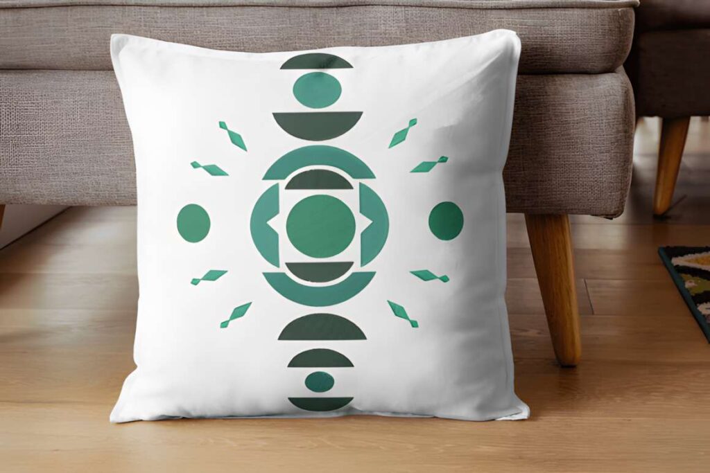 White cushion with geometric abstract embroidery art featuring circles — machine embroidery designs for various styles