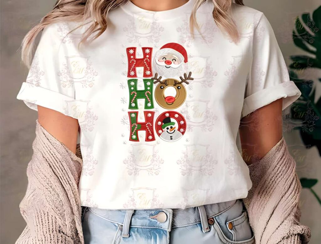 White t-shirt with Santa Holiday Xmas machine embroidery designs for various styles featuring Santa, reindeer, and snowman