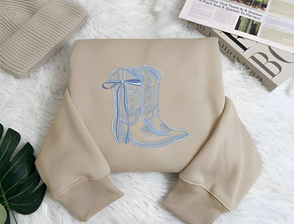 Machine embroidery designs for various styles featuring cowboy boots with floral detailing on beige fabric
